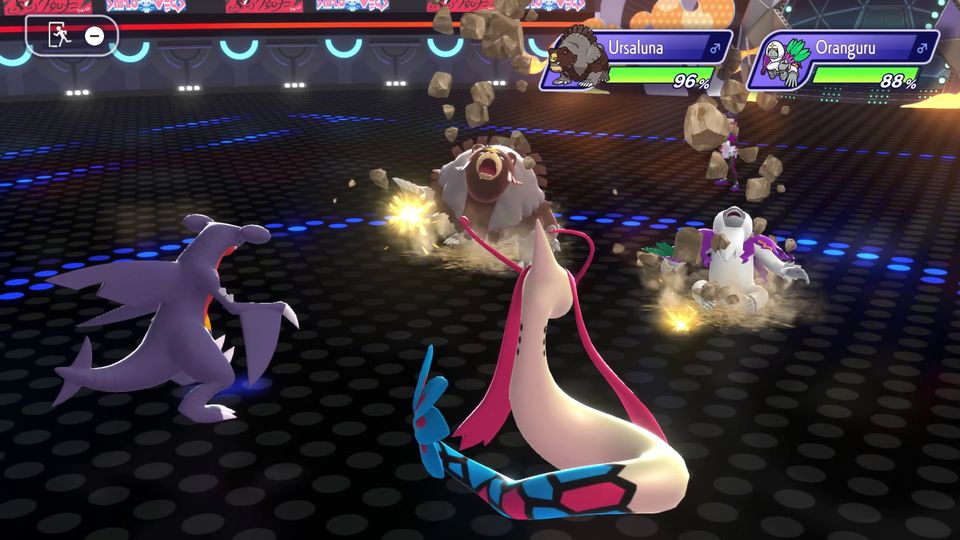 A Pokémon battle showing Garchomp and Milotic versus Ursaluna and Oranguru. Ursaluna and Oranguru are taking damage.